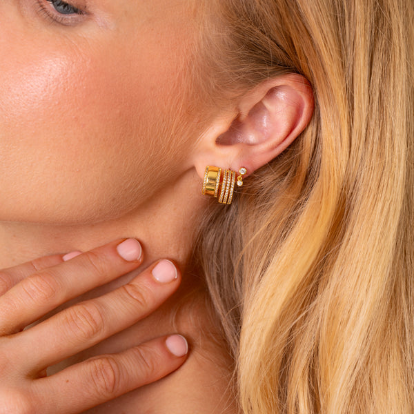 Ear stack featuring the Vega gold pave hoop earring with dainty gold earrings - Rainbow Rocks