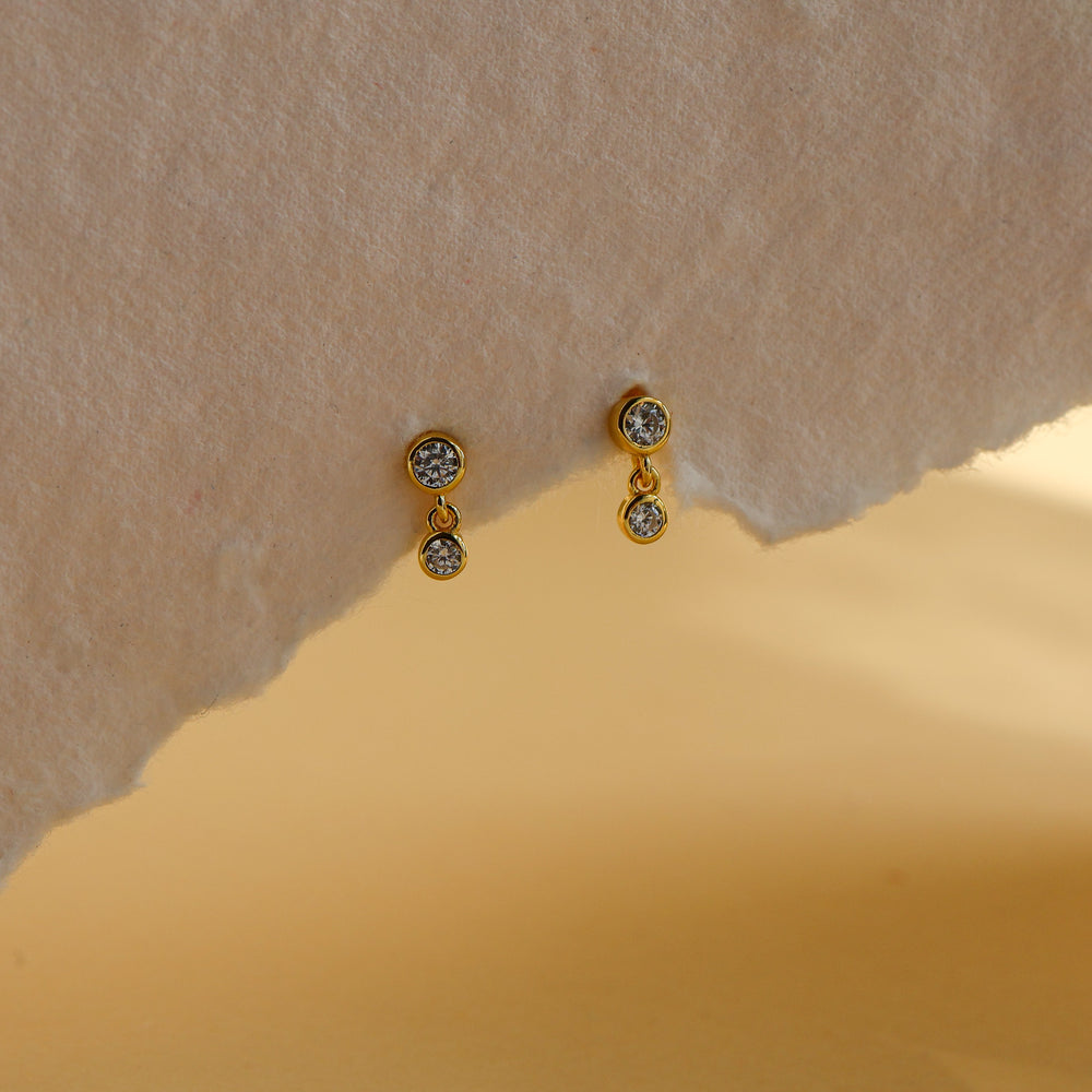 Leda dainty double drop stud earrings in 18K gold plated sterling silver, a 2.5mm bezel CZ stud with a 2mm CZ drop