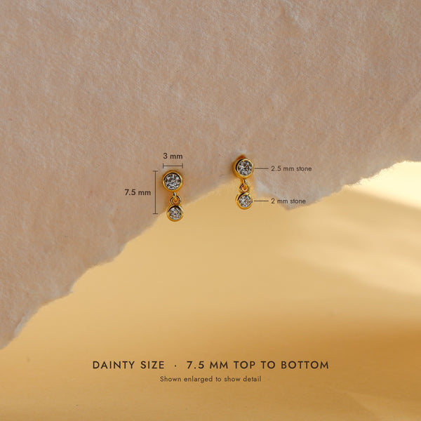 Leda earring size guide: 7.5mm long, 3mm wide, with 2.5mm and 2mm cubic zirconia stones