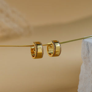 Luna gold huggie hoops with a polished centre band and white CZ edges - Rainbow Rocks