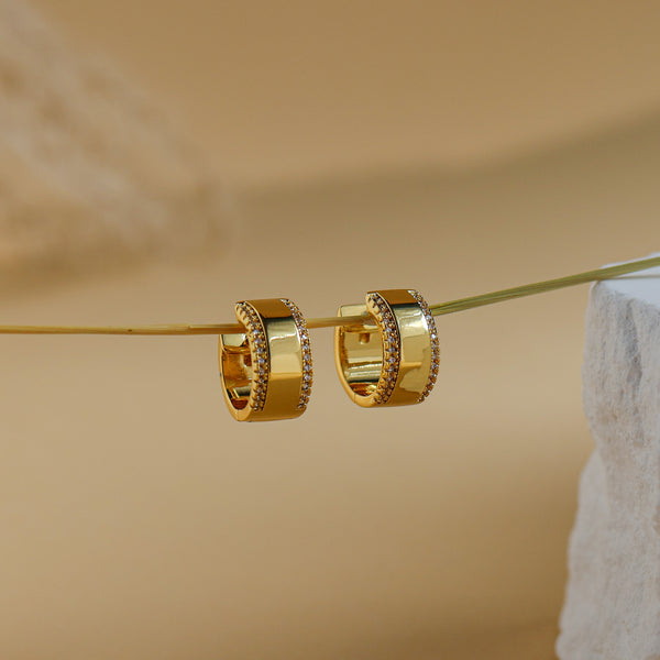 Luna gold huggie hoops with a polished centre band and white CZ edges - Rainbow Rocks
