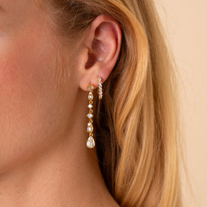 Model wearing the Soleil long CZ drop earring with the Carina CZ J-hoop in a second piercing, 18K gold plated - Rainbow Rocks