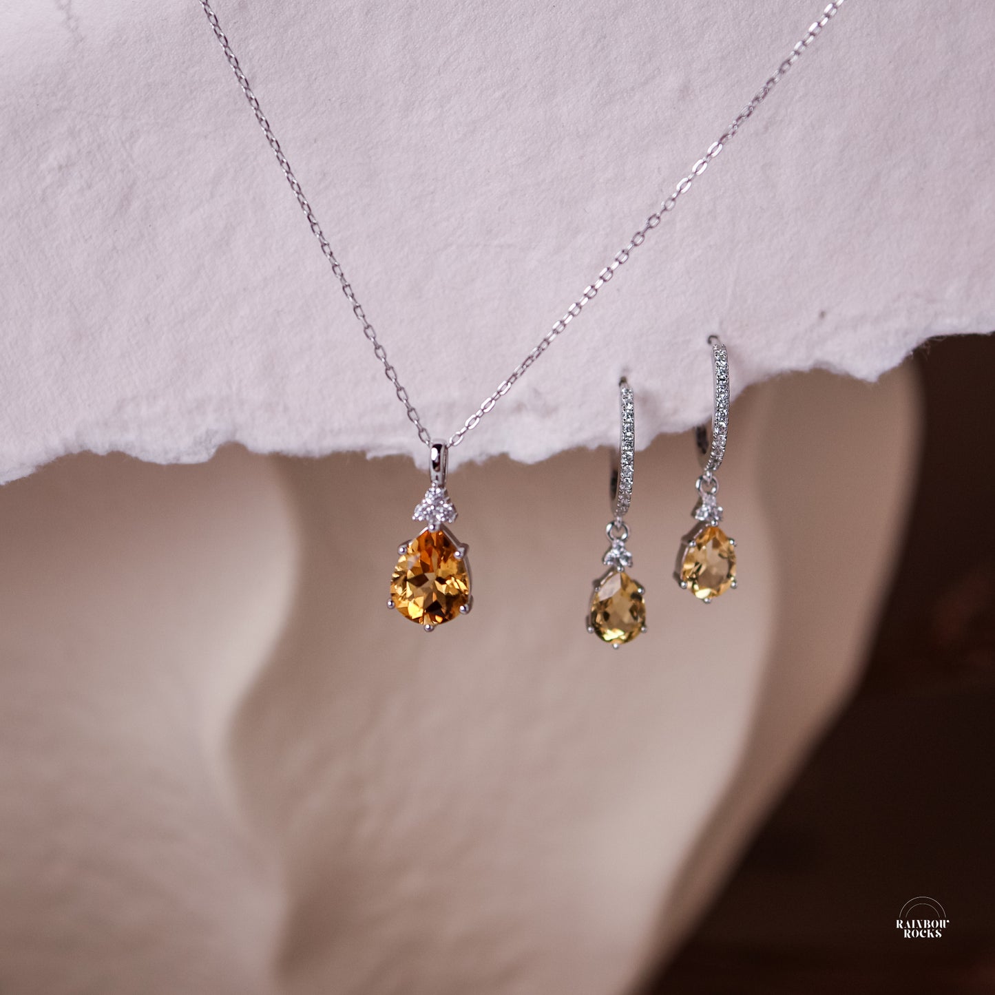 Layla Natural Citrine Necklace Silver displayed along with the matching earring hoops