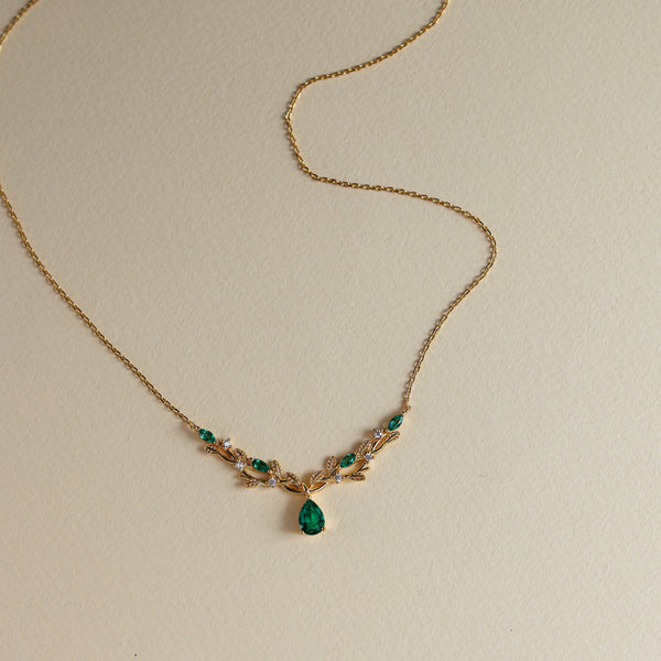 Vine lab emerald pear-cut necklace on model - Rainbow Rocks