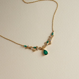 Vine lab emerald pear-cut necklace on model - Rainbow Rocks