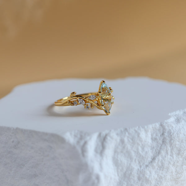Side view of the Vine Natural Aquamarine Ring in 14K gold vermeil showing the leaf detail and CZ accents - Rainbow Rocks Jewellery