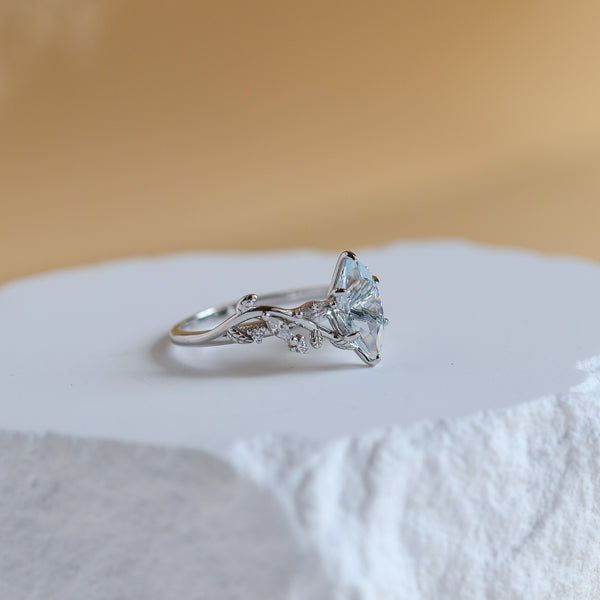 Side view of the Vine Natural Aquamarine Ring in sterling silver showing the leaf detail and CZ accents - Rainbow Rocks Jewellery